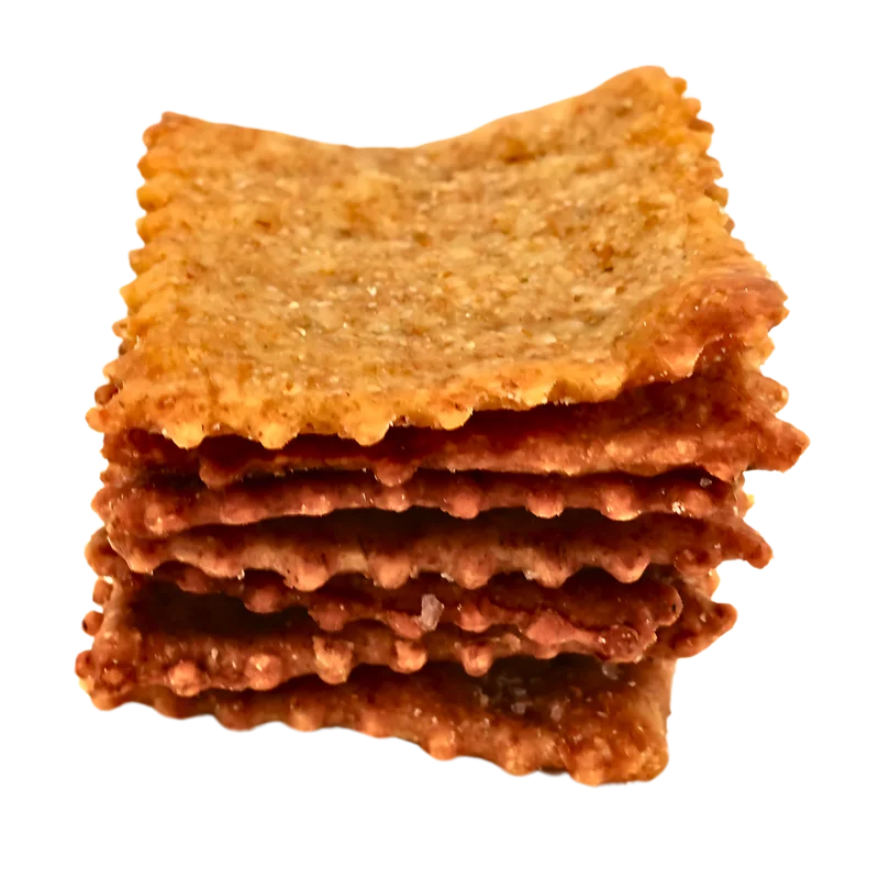 A neat stack of Maake sourdough crackers showing the flaky layers