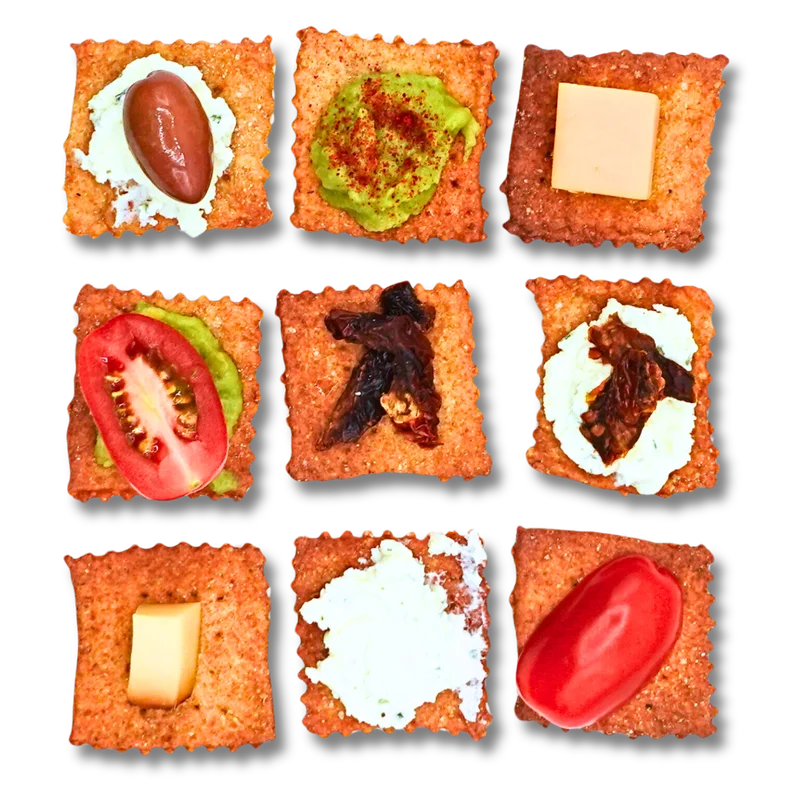 Nine Soleado crackers each topped with a different fresh ingredient